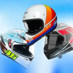 Tre caschi moto in primo piano, uno bianco con grafica retrò, uno bianco con disegno invernale e il numero 46, e uno grigio con dettagli rossi. Un test caschi moto completo.