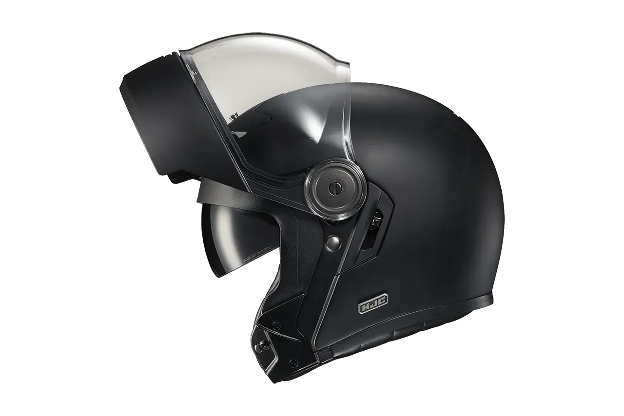 Casco nero con visiera sollevata, pronto per un viaggio senza mal di testa.